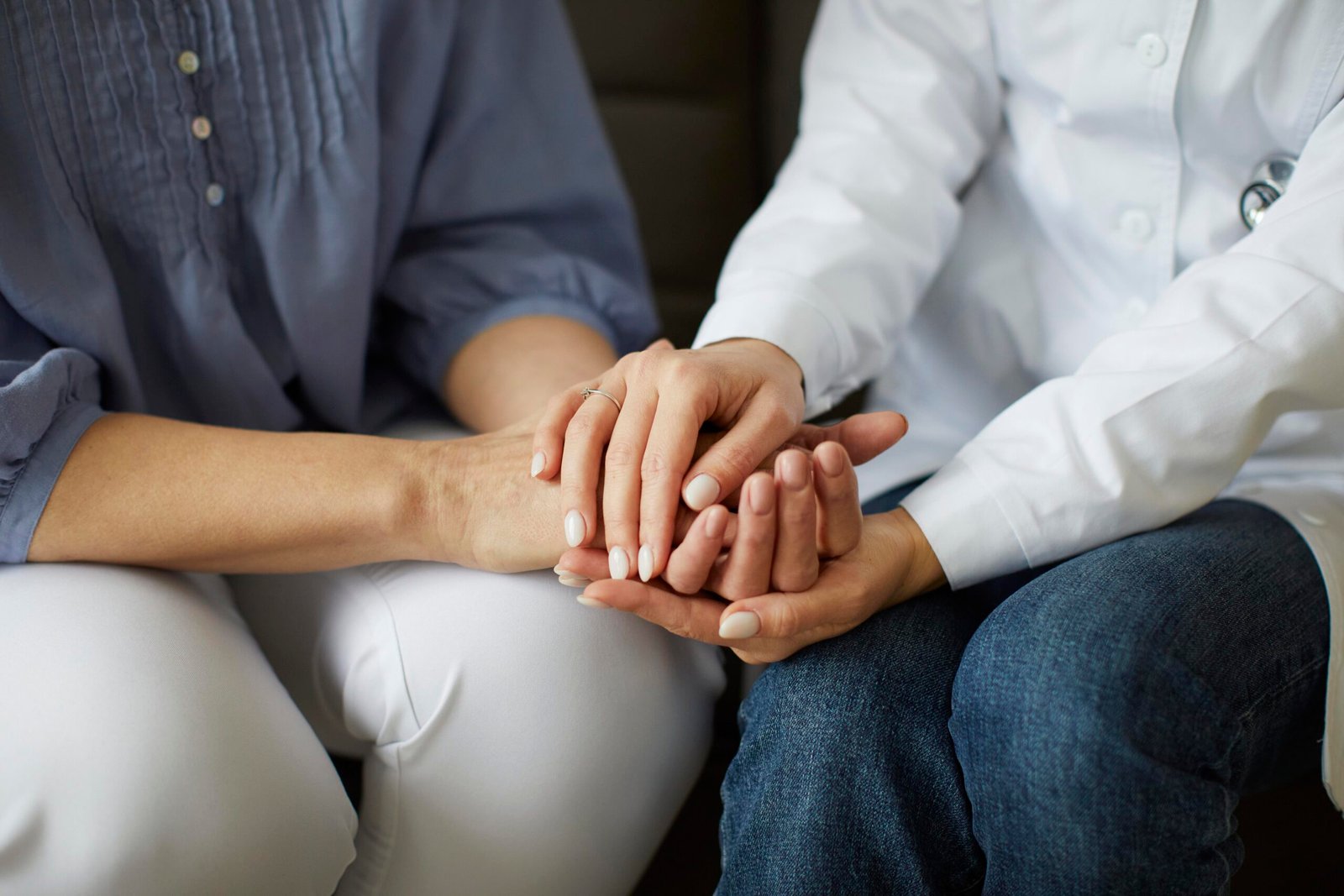 covid-recovery-center-female-doctor-holding-elder-patient-s-hands